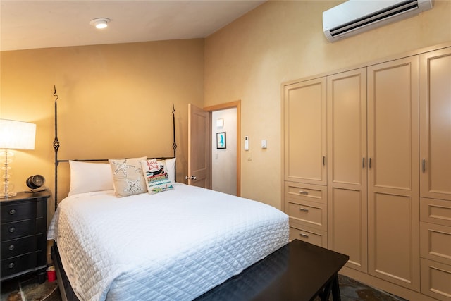 bedroom featuring a closet and a wall unit AC