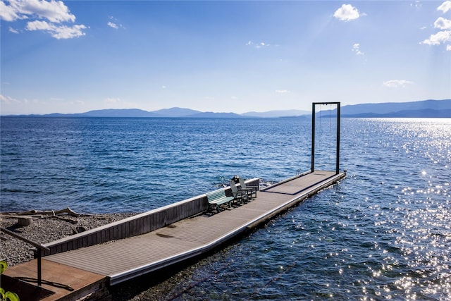 dock area with a water and mountain view