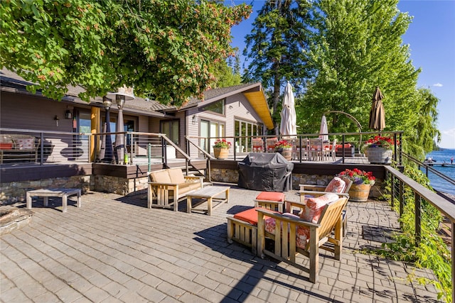 view of patio with an outdoor hangout area, a deck, and area for grilling