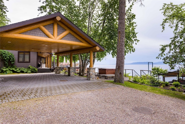 exterior space with a hot tub