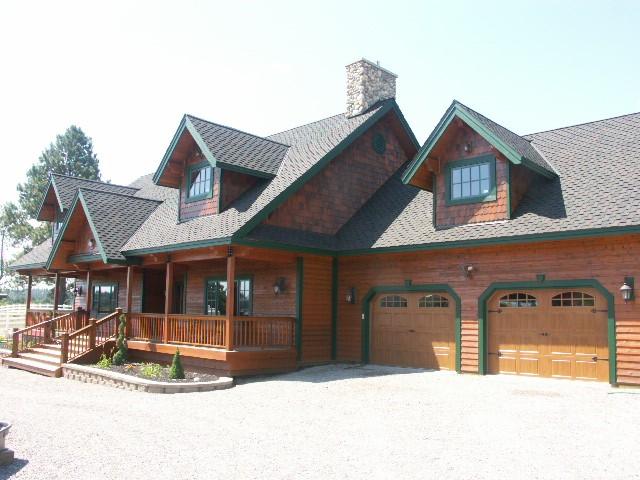 view of front facade with covered porch and an attached garage