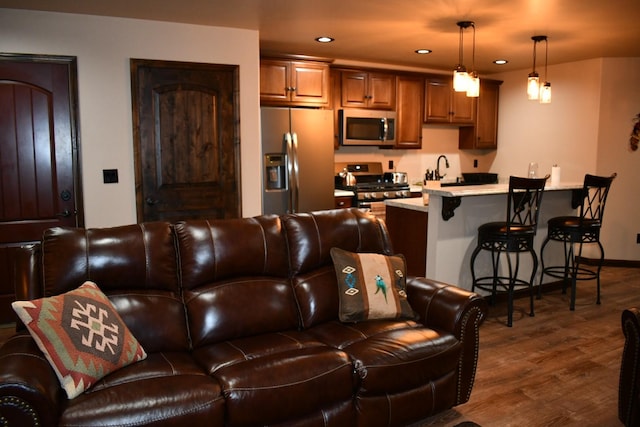 living room featuring dark wood-style floors, baseboards, and recessed lighting