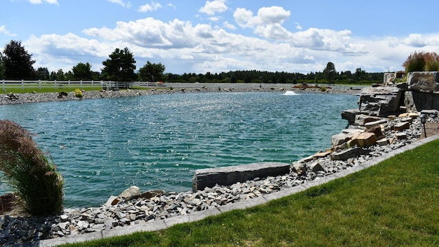 water view featuring fence