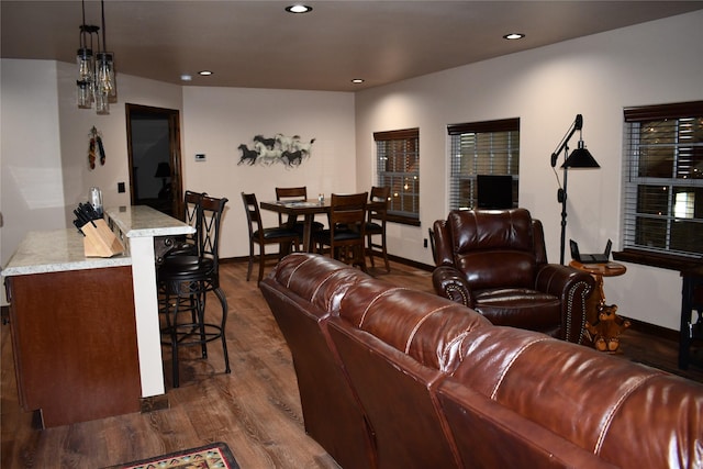 living area with a chandelier, recessed lighting, dark wood-style flooring, and baseboards