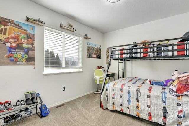 bedroom with carpet floors, baseboards, and visible vents