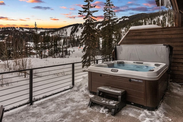 exterior space with fence and a hot tub