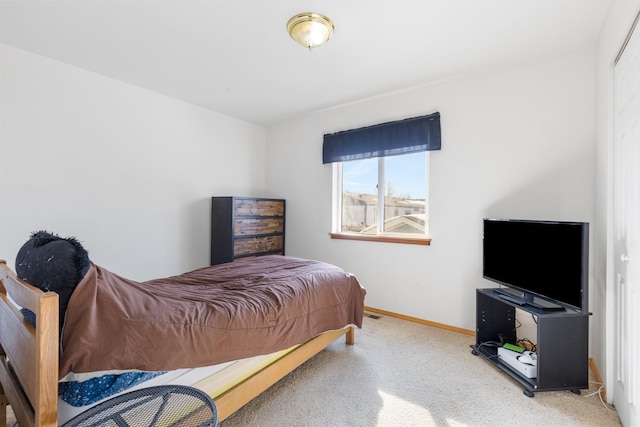 carpeted bedroom with baseboards