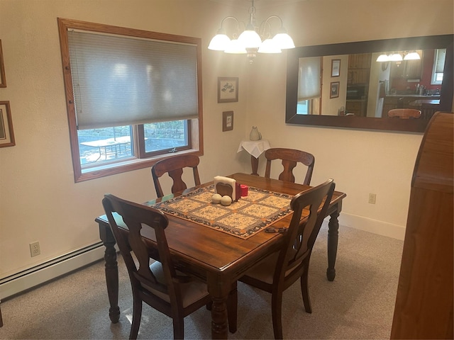 dining room featuring a chandelier, carpet floors, baseboard heating, and baseboards