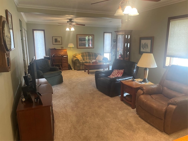 living area featuring ceiling fan, ornamental molding, and light colored carpet