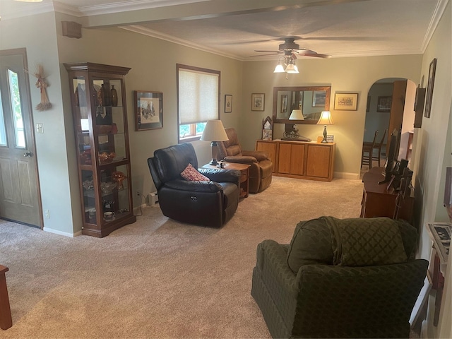 living room with arched walkways, light colored carpet, crown molding, and baseboards