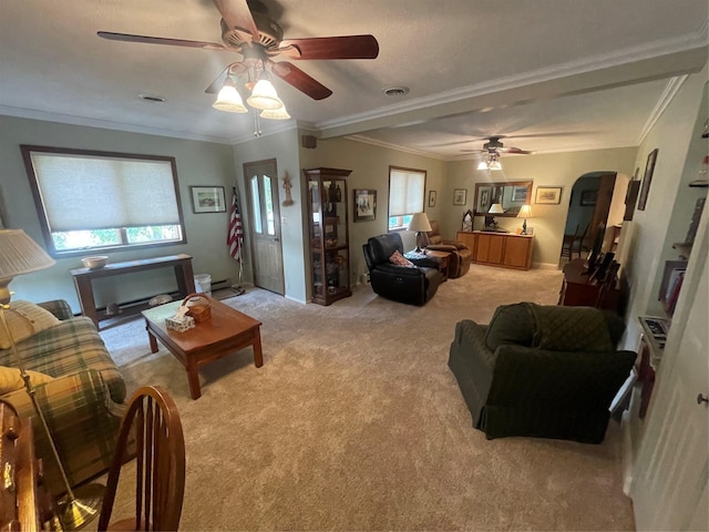 living room with arched walkways, ornamental molding, light carpet, and visible vents