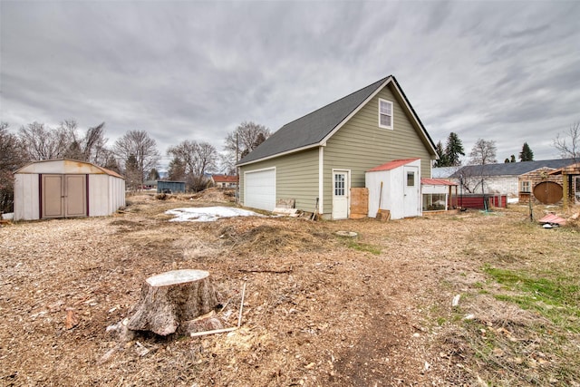 view of side of property featuring an outbuilding and a storage shed