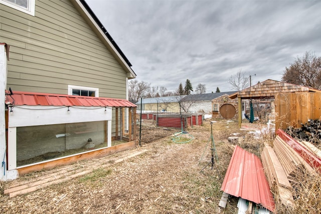 view of yard with an outbuilding and a garden