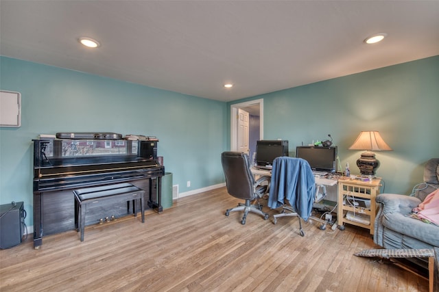 home office featuring recessed lighting, baseboards, and wood finished floors