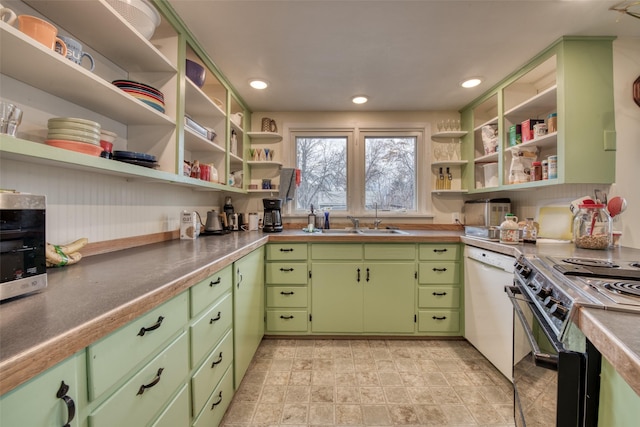 kitchen with open shelves, stove, white dishwasher, and a sink