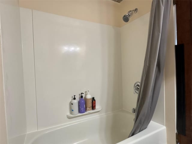 full bathroom featuring shower / bath combination with curtain