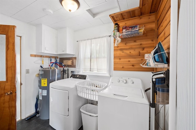 laundry area with washer and dryer, laundry area, and water heater