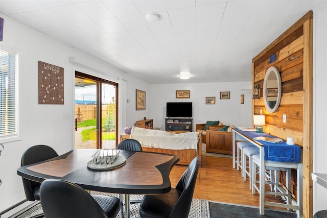 dining space featuring wood finished floors