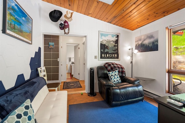 living room with vaulted ceiling, a baseboard heating unit, and wooden ceiling