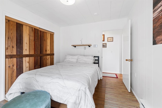 bedroom featuring wood finished floors