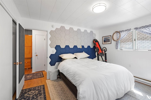 bedroom with wood finished floors