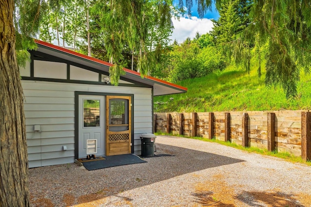 view of outbuilding with fence