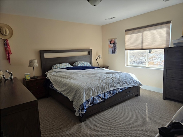 bedroom featuring carpet, visible vents, and baseboards