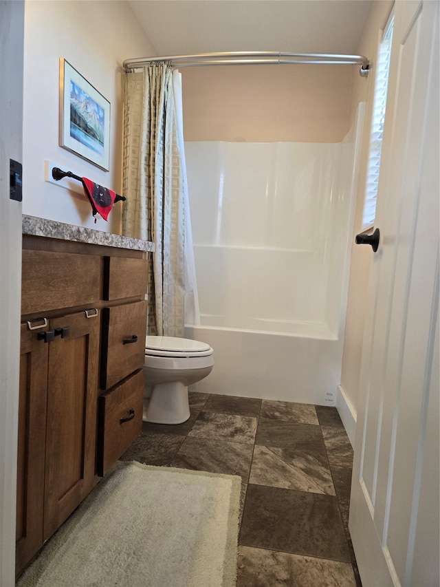 full bath with shower / bath combo with shower curtain and toilet