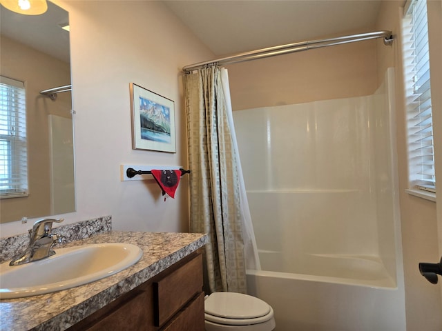 bathroom featuring shower / bathtub combination with curtain, toilet, and vanity