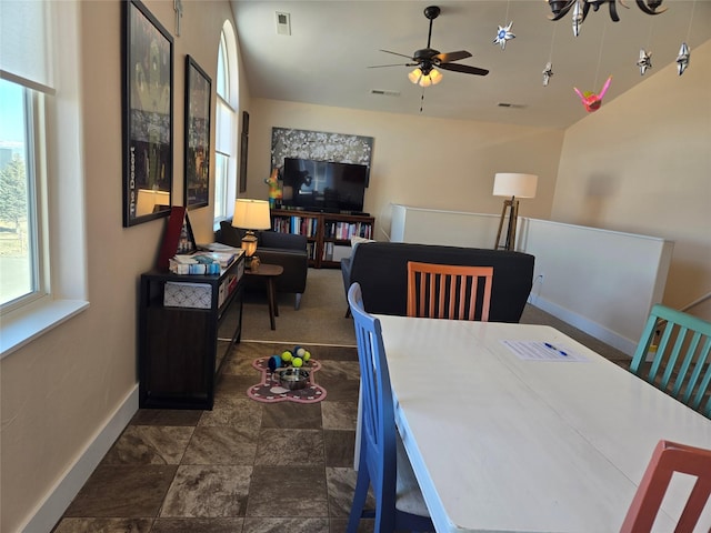 dining space featuring ceiling fan, visible vents, and baseboards