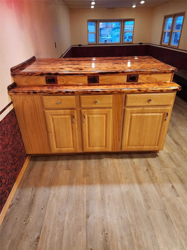 bar with light wood-style floors