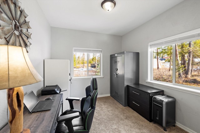 home office featuring baseboards and light colored carpet