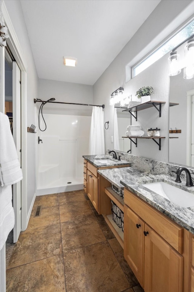 full bath with double vanity, a shower with curtain, visible vents, and a sink