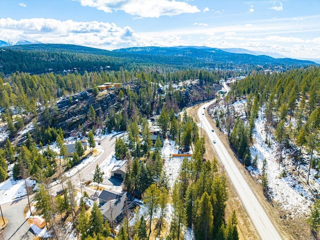 aerial view with a mountain view and a forest view