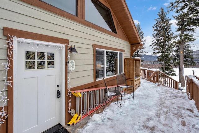 view of snow covered property entrance