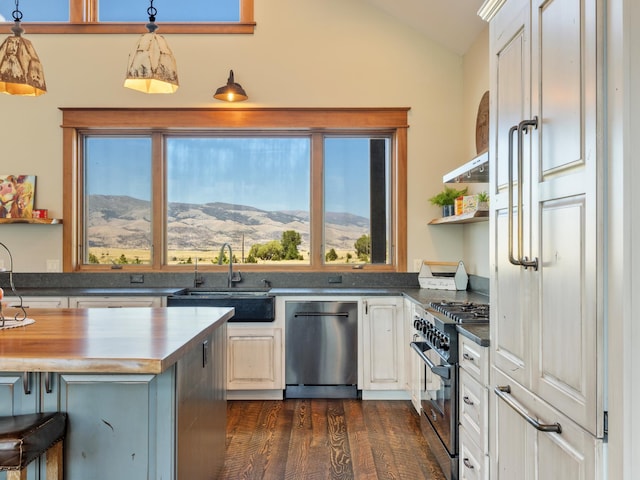 kitchen featuring open shelves, high end range, a sink, butcher block countertops, and under cabinet range hood