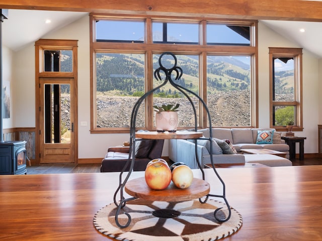 details with wood finished floors, a wood stove, and recessed lighting