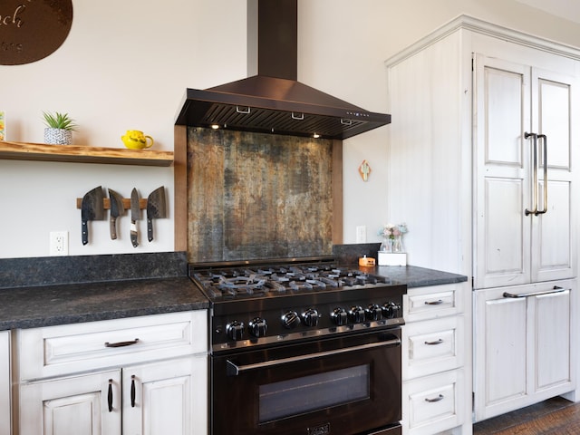 kitchen featuring black gas range oven, dark countertops, ventilation hood, white cabinetry, and open shelves