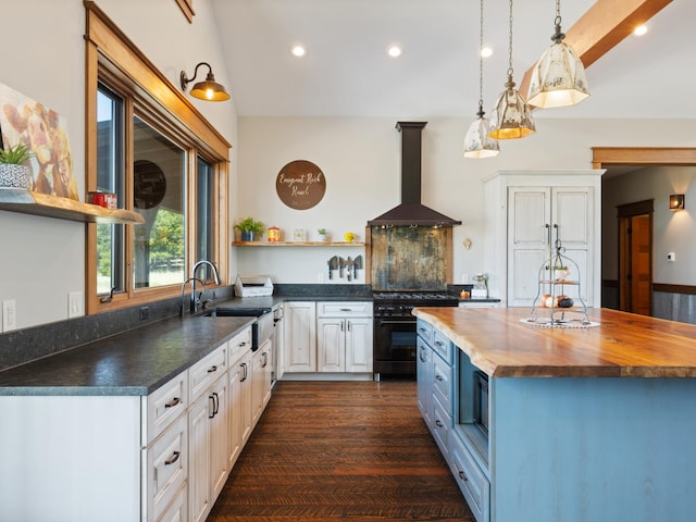 kitchen with open shelves, a sink, black gas stove, ventilation hood, and butcher block countertops