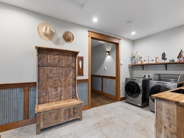 laundry area featuring recessed lighting, laundry area, wainscoting, and independent washer and dryer