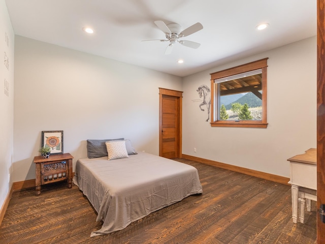 bedroom featuring a ceiling fan, baseboards, wood finished floors, and recessed lighting