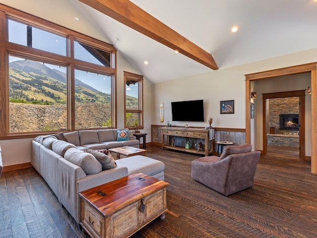 living room with plenty of natural light, high vaulted ceiling, beamed ceiling, and a fireplace