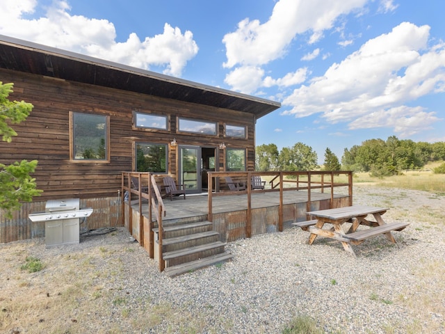 wooden deck featuring grilling area