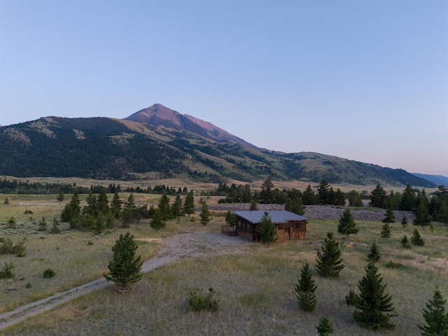 mountain view featuring a rural view