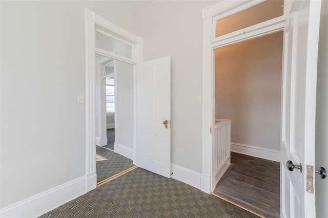 interior space featuring baseboards