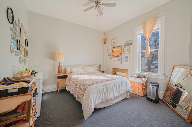 bedroom featuring a ceiling fan, carpet flooring, and baseboards