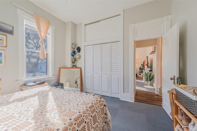 carpeted bedroom with a closet