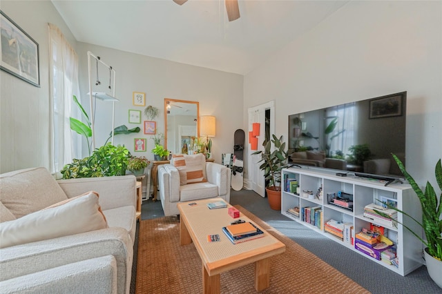 carpeted living room featuring a ceiling fan