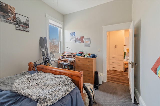 carpeted bedroom with baseboards