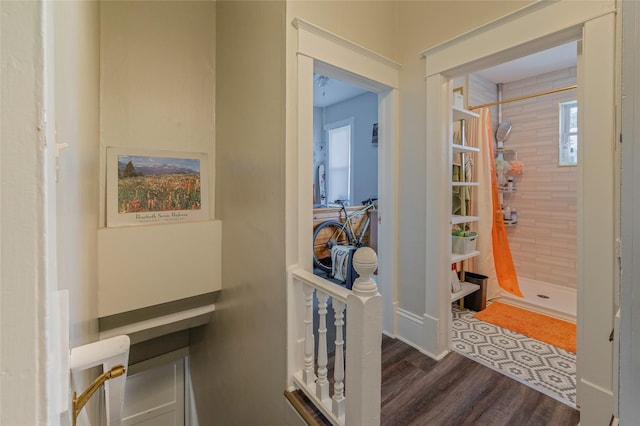 hallway with wood finished floors